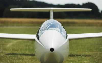 Glider standing on grass ground front view